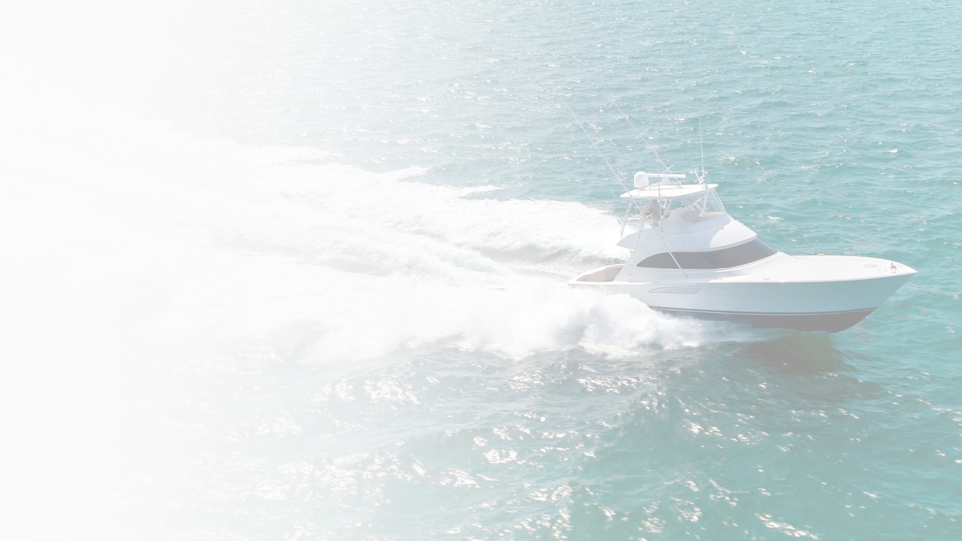 Couple sitting on railing of a yacht